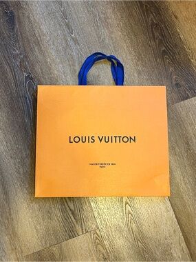 Louis Vuitton branded shopping tote.